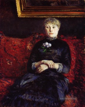  sitzt Galerie - Frau sitzt auf einem roten Flowered Sofa Gustave Caillebotte